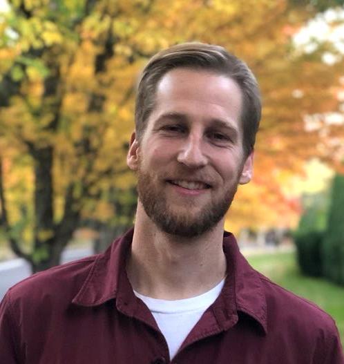 Evan Thatcher in front of trees