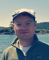 Cory Simon in front of water