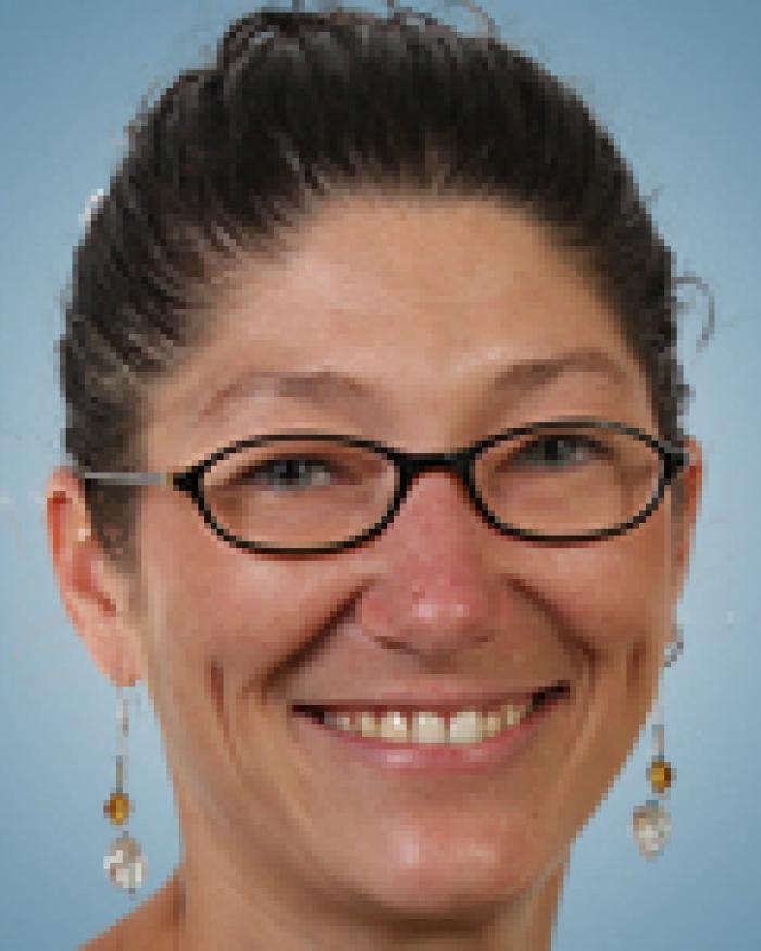 Jennifer Parham-Mocello in front of a blue background
